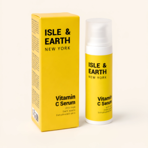 Isle & Earth Vitamin C Serum bright yellow bottle and packaging box on cream background