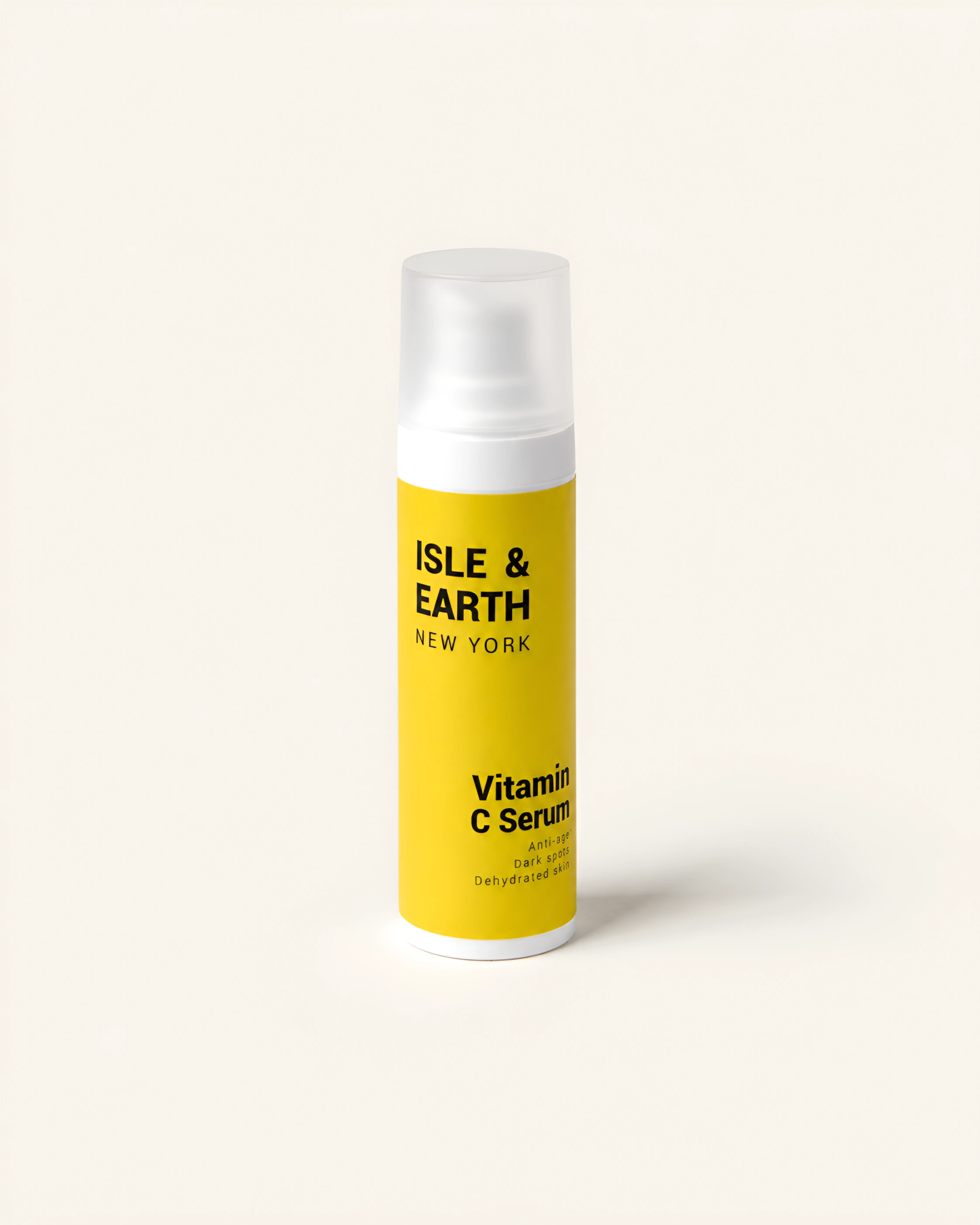 Isle & Earth Vitamin C Serum white airless pump bottle with bright yellow label on cream background